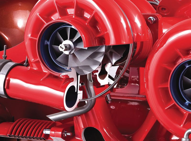 Close-up of series-mounted twin turbochargers on a heavy commercial vehicle engine